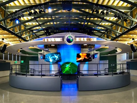 Blue Planet Theater's side screens, waterfall projection and central topographical surface