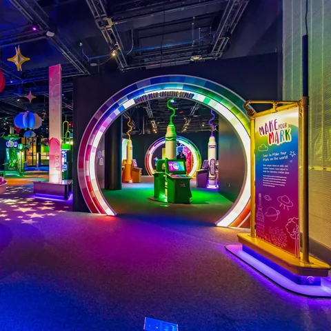 Colorful interactive stations and circular portals at Crayola IDEAworks
