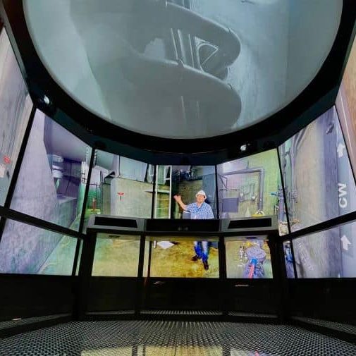 Curved video displays and an overhead projection dome at Romero Visitor Center