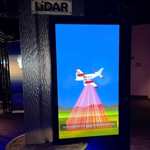 A Vista del Lago display illustrates an aircraft using LiDAR to measure the landscape