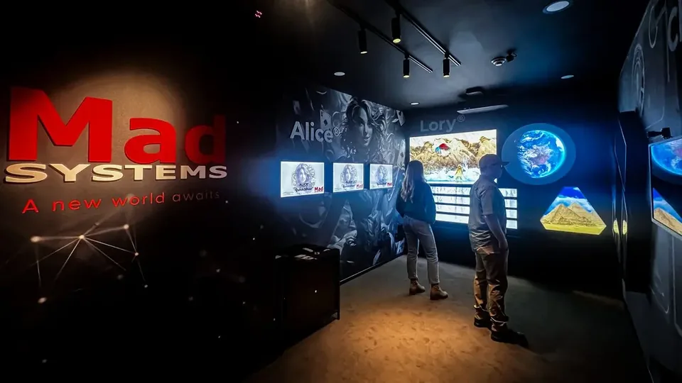 Visitors explore digital exhibits in Mad's Wonderland demonstration room